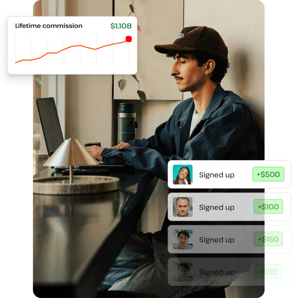 Man sitting at a computer with a rising graph on the screen, representing affiliate marketing success